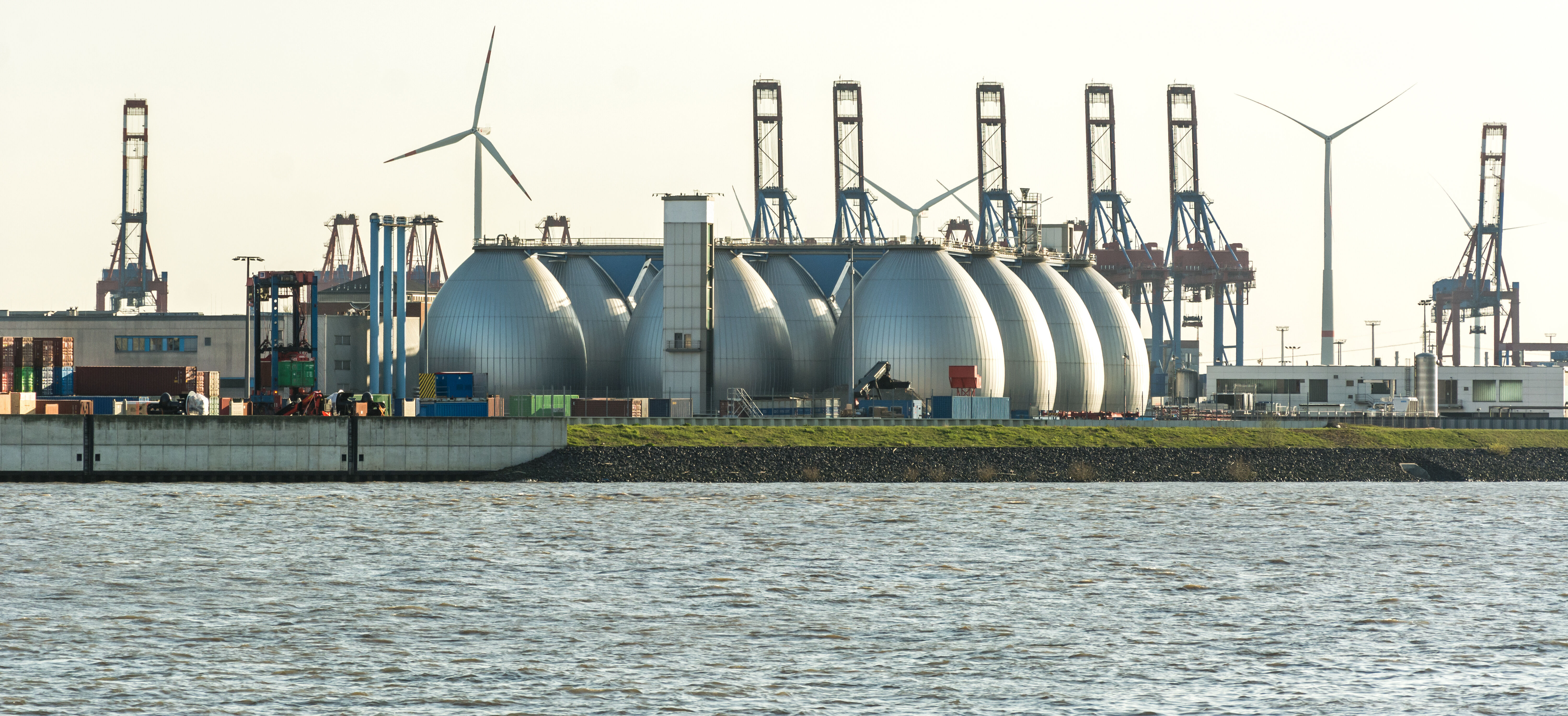 Gas storage reservoir, wind turbines and cranes in the harbour - Spray Nozzles for The Energy Industry